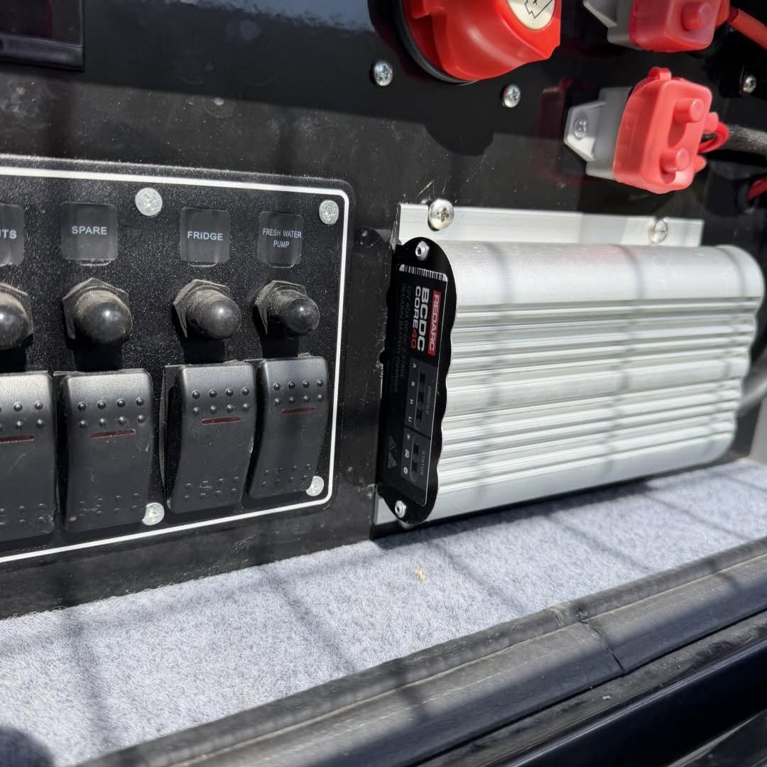 Close up of a switch panel with USB and 12 volt outlets